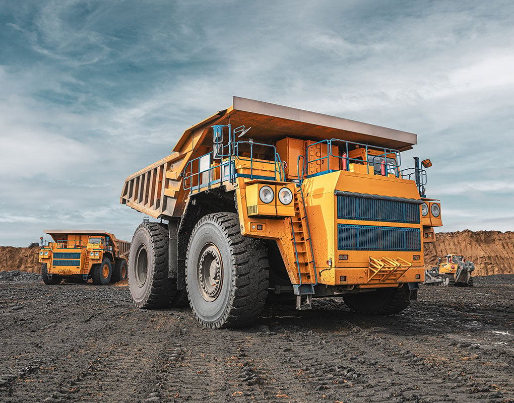 construction trucks in the dirt field